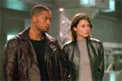 Will Smith as Detective Spooner and Bridgit Moynahan as Dr. Susan Calvin in I, Robot