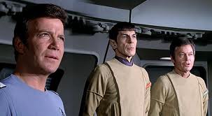 William Shatner, Leonard Nimoy and DeForest Kelly staring at the view screen in Star Trek: The Motion Picture